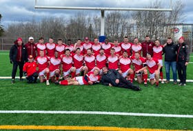 The Memorial Sea-Hawks pose under the goal posts after winning the championship final of the AUS men's rubgy tournament Sunday in Halifax. — twitter/@Rugby_NL