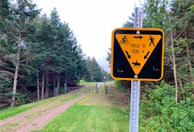 A sign on the Confederation Trail in Emerald advises users on how to proceed if they encounter a horse during the Equestrian Pilot Project, which began on Aug. 15 and wraps up Nov. 15. 