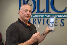 Const. Ron Kennedy of the Charlottetown Police Services displays the new SoToxa mobile test system that officers across the province, both municipal and federal, now have access to in order to perform roadside screening for cannabis use. Kennedy demonstrated how the device is used at police headquarters in Charlottetown on Nov. 10.