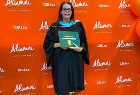 Mary Lou Gould poses for photos on her graduation day at Cape Breton University earlier this month. Gould, 50, earned a bachelor of education degree after what she calls "a long and winding journey." CONTRIBUTED