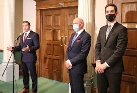 (From left) Premier Andrew Furey, Health Minister Dr. John Haggie and Justice Minister John Hogan speak to reporters Monday outside the House of Assembly about the recent cyberattack on the province’s health-care system.