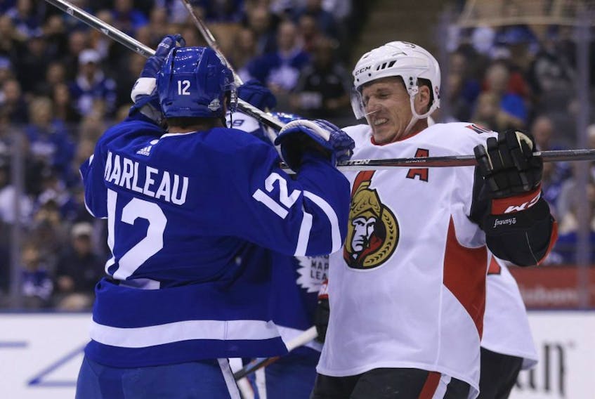  Dion Phaneuf, by then a member of the Ottawa Senators, trades jousts with former Maple Leaf Patrick Marleau in 2018. JACK BOLAND/SUN FILES