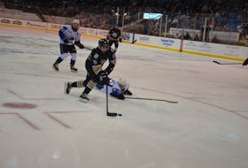 Charlottetown Islanders defenceman Noah Laaouan maneuvers his way around the Saint John Sea Dogs’ Cole Foston in a Quebec Major Junior Hockey League game at Eastlink Centre earlier this season. The Islanders begin a four-game homestand against the Moncton Wildcats on Nov. 18 at 7 p.m. 