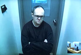 Matthew Twyne appears on video in provincial court in St. John’s from Her Majesty‘s Penitentiary on Thursday, Nov. 18, as he waits for Judge Lori Marshall to enter to room and deliver her sentencing decision.