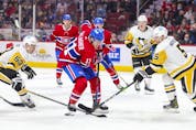 Montreal Canadiens' Brendan Gallagher has the puck poked away by Pittsburgh Penguins' Teddy Blueger, left, and Michael Matheson during third period in Montreal Thursday, Nov. 18, 2021.