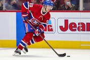 Montreal Canadiens' Mattias Norlindder handles the puck during first period in Montreal Thursday, Nov. 18, 2021.