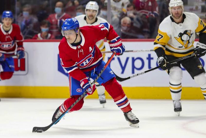 Montreal Canadiens' Brendan Gallagher takes a shot during first period in Montreal Thursday, Nov. 18, 2021.