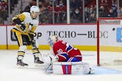Pittsburgh Penguins' Zach Aston-Reeves shoots the puck past Montreal Canadiens goalie Cayden Primeau for his team's 4th goal during second period in Montreal Thursday, Nov. 18, 2021. 