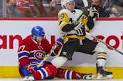 Montreal Canadiens' Brett Kulak drags down Pittsburgh Penguins' Jake Guentzel during second period in Montreal Thursday, Nov. 18, 2021. 