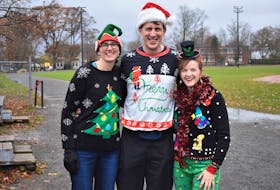 Organizers Christine Bulk (left), Brian Merrill, and Corina Frank are looking forward to the Ugly Christmas Sweater Run which will take place Dec. 5 at the TAAC Grounds in Truro.