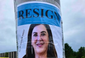The Memorial University of Newfoundland Faculty Association says a directive to remove posters showing a photo of MUN president Vianne Timmons with the word “RESIGN” across the top and the words “no to tuition hikes” along one side is an attack on free expression and academic freedom. (Photo by @MatthewBarter)