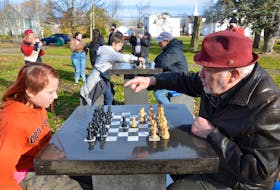 10-year-old Piper Wagstaff plays reigning Nova Scotia Open chess champion Roger Langen in the first game officially played on new concrete chess tables in Middleton’s Centennial Park. KIRK STARRATT