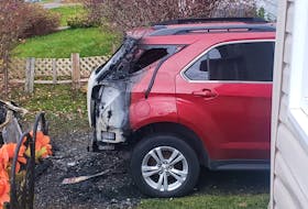Damage to a GMC SUV in the driveway at 8 Cornwall St., North Sydney. Two vehicles were destroyed in the fire which also caused damage to the siding. Contributed/Amanda Ashford

