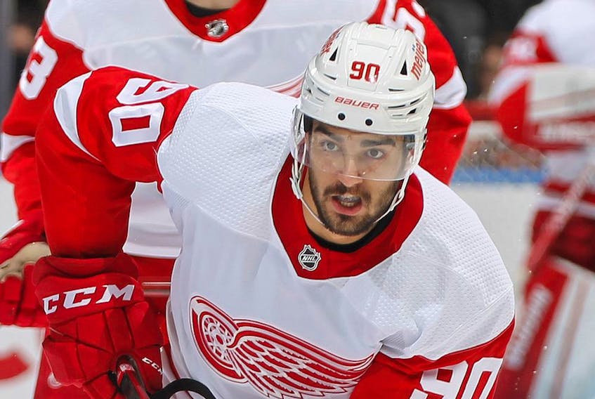  Joe Veleno #90 of the Detroit Red Wings skates with the puck against the Toronto Maple Leafs during an NHL game at Scotiabank Arena on Oct. 30, 2021 in Toronto.