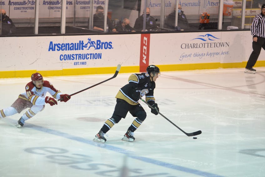 Charlottetown Islanders defenceman William Trudeau, 2, carries the puck up the ice as the Acadie-Bathurst Titan forward Bennett MacArthur of Summerside applies pressure. The action took place during the second period of a Quebec Major Junior Hockey League (QMJHL) game at Eastlink Centre on Nov. 20. The Islanders won the game 6-2.