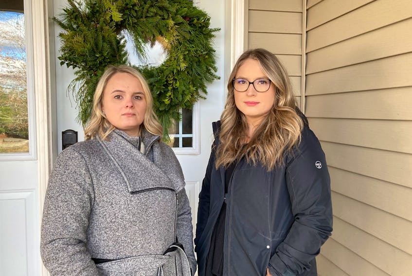 Leah Profitt (left) and Lacey Conrad said they still hope that someone will come forward with information leading to charges in the homicide of their mother, Leslie Ann Conrad. She was found dead in woods south of Wolfville 15 years ago, after going missing seven weeks earlier.
