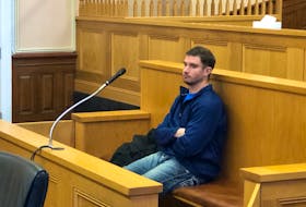 Steven Noseworthy, 30, sits in the dock in a courtroom at Newfoundland and Labrador Supreme Court in St. John's during a break in his money laundering trial Nov. 22.