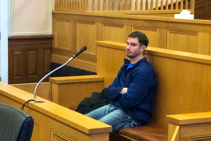 Steven Noseworthy, 30, sits in the dock in a courtroom at Newfoundland and Labrador Supreme Court in St. John's during a break in his money laundering trial Nov. 22.