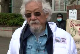 Environmentalist David Suzuki donned a white jacket with his foundation's logo while speaking to CHEK News. 
