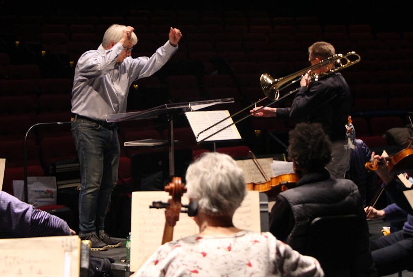 Mark Shapiro conducts the full orchestra during rehearsal for the first time since COVID-19 restrictions were put in place. 
