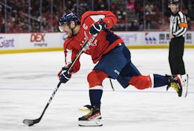 Alex Ovechkin of the Washington Capitals takes a slap shot against the Pittsburgh Penguins during the second period at Capital One Arena on Nov. 14, 2021, in Washington.