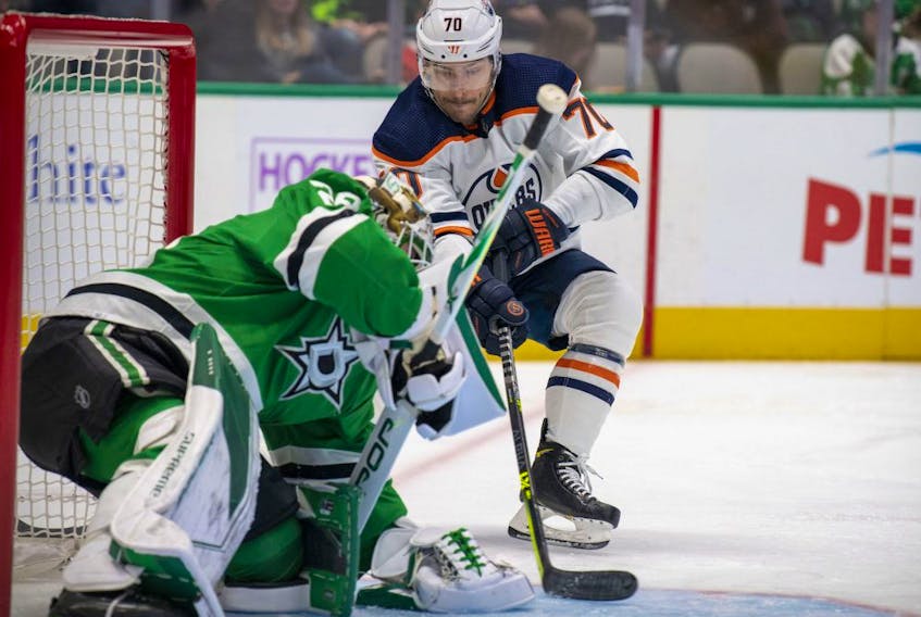 Dallas Stars goaltender Jake Oettinger (29) stops a shot by Edmonton Oilers center Colton Sceviour (70) during the first period at the American Airlines Center on Nov. 23, 2021. 