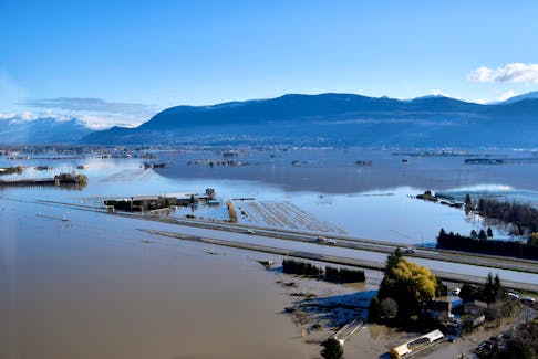 The Trans Canada highway remains partially submerged by flood water near Abbottsford, B.C., Nov. 19, 2021, after rainstorms lashed British Columbia, triggering landslides and floods and shutting highways.