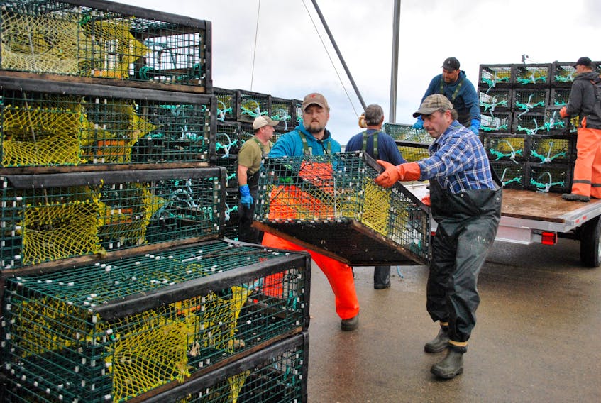 Woods Harbour fishermen offload traps at the Falls Point wharf in preparation for the upcoming commercial lobster fishery in Southwestern Nova Scotia. KATHY JOHNSON