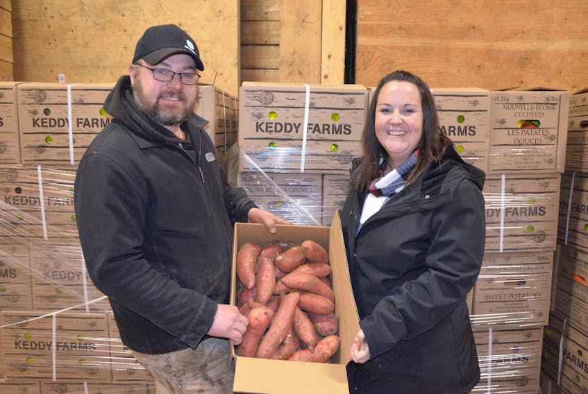 Philip and Katie Keddy of Charles Keddy Farms Ltd. in Lakeville are the largest producers of sweet potatoes east of Ontario. They will be representing the Atlantic region in the upcoming Canada’s Outstanding Young Farmers competition. KIRK STARRATT