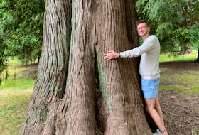Sam Thompson, creator of Sam Co. Creations, says his hugging a tree is fitting since the products he creates centre around recycling. Contributed