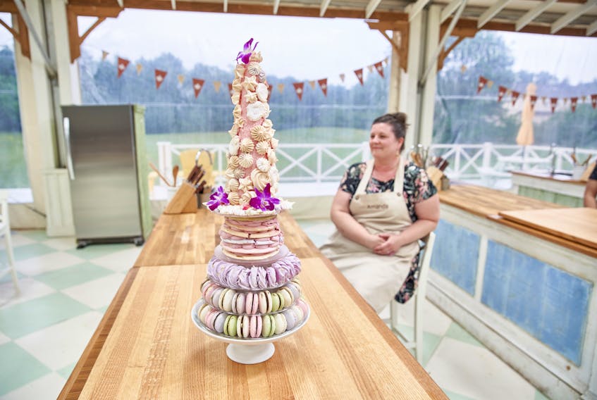 Amanda Muirhead sits near a meringue centrepiece she made during the shooting of an episode of the Great Canadian Baking Show. Muirhead, who is from P.E.I., was eliminated in the quarter finals. 