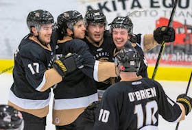 In this file photo, his  Newfoundland Growlers teammates congratulate Marcus Power (second from left) after he scored a goal in an ECHL game at the C.B.S. Arena. The Growlers don't have any players among the top dozen point-getters in the ECHL, but have been getting widespread contributions from many players in fashioning the second highest-scoring offence in the league and building up an ECHL-leading 11-2-0 record, including seven straight road wins. — Newfoundland Growlers photo/Jeff Parsons