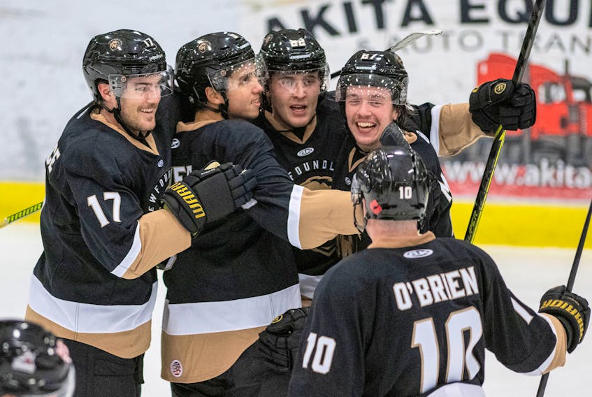 In this file photo, his  Newfoundland Growlers teammates congratulate Marcus Power (second from left) after he scored a goal in an ECHL game at the C.B.S. Arena. The Growlers don't have any players among the top dozen point-getters in the ECHL, but have been getting widespread contributions from many players in fashioning the second highest-scoring offence in the league and building up an ECHL-leading 11-2-0 record, including seven straight road wins. — Newfoundland Growlers photo/Jeff Parsons