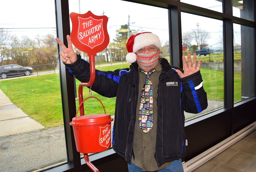 Vince Steffens mans the Salvation Army red kettle at the Nova Scotia Liquor Corporation store in Sydney Mines. Steffens said someone stole his mountain bike while he was volunteering at the store Saturday. Although old and rusty, it was his only transportation. SHARON MONTGOMERY-DUPE/CAPE BRETON POST