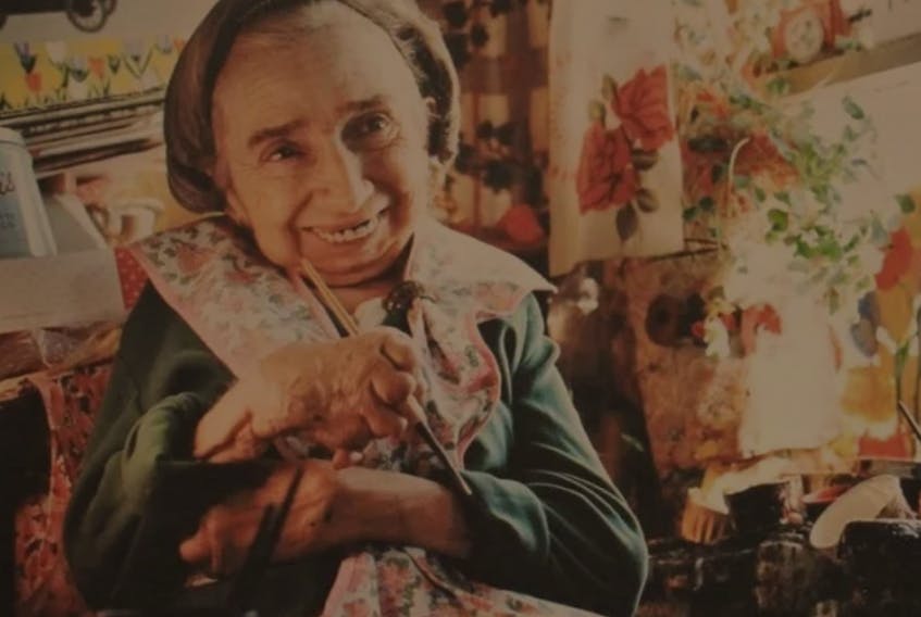 A depiction of famous artist Maud Lewis, at work.