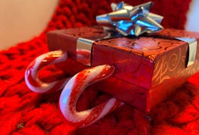 Want to up the wow factor on a small present, like a gift card? Create a candy cane sleigh.