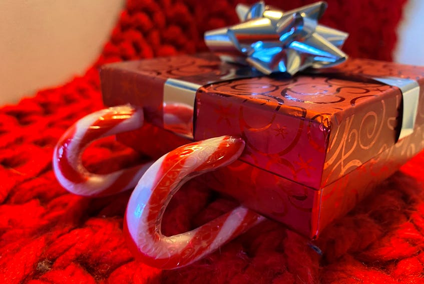 Want to up the wow factor on a small present, like a gift card? Create a candy cane sleigh.