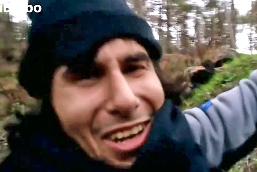  In an image from an Islamic State propaganda video, Safwan Al-Kanadi, identified as Sami Elabi from Montreal, reacts with joy at an explosion destroying a building.