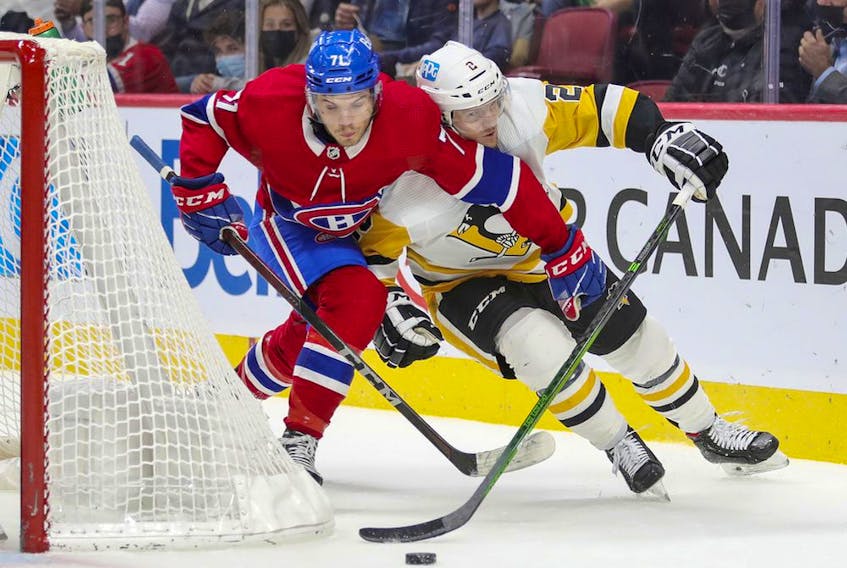 Montreal Canadiens' Jake Evans tries to cut in front of Pittsburgh Penguins defenceman Chad Ruhwedel during first period in Montreal on Nov. 18, 2021.