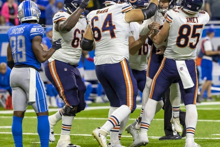 The Chicago Bears celebrate their win over the Lions at Ford Field in Detroit Thursday. USA TODAY SPORTS