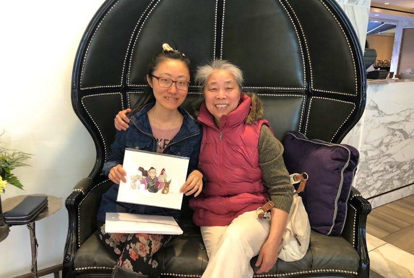 The author Hui Zhou and her grown-up daughter Niu Niu, who now live in Nova Scotia, have made celebrating Christmas an annual tradition, even though it’s not a holiday back in their native China. Contributed photo