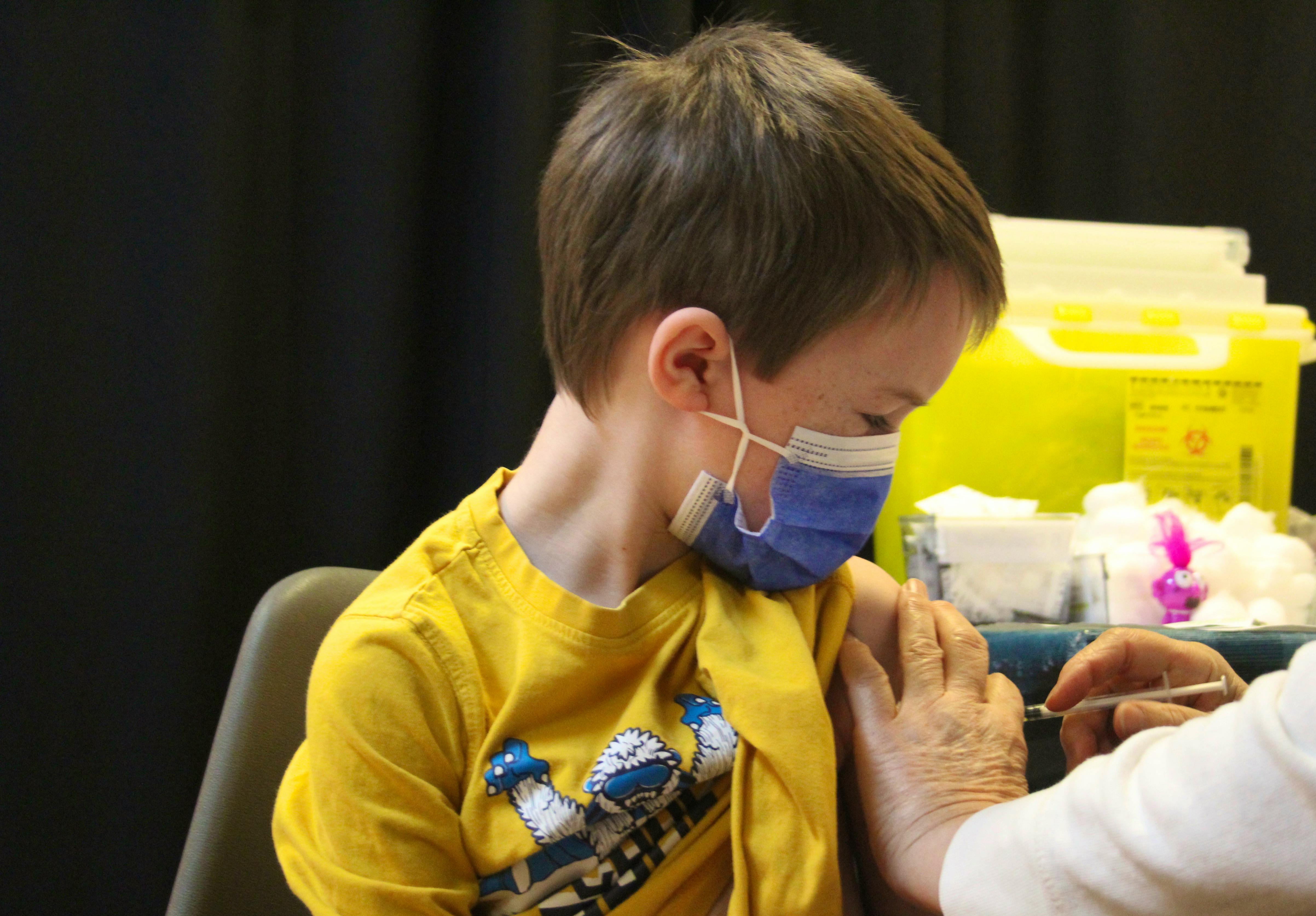 Hudson Holmes, 7, was one of the children who showed up to the vaccination clinic at the County Fair Mall for his first dose of the COVID-19 vaccine. Friday, Nov. 26, was the first day in P.E.I. that kids between the ages of five and 11 were eligible to be vaccinated. Hudson's mother, Becky Holmes, said she was "a little unsure, but I think this is the right direction to go at this point." Her son, she said, was relieved to finally get his vaccination.