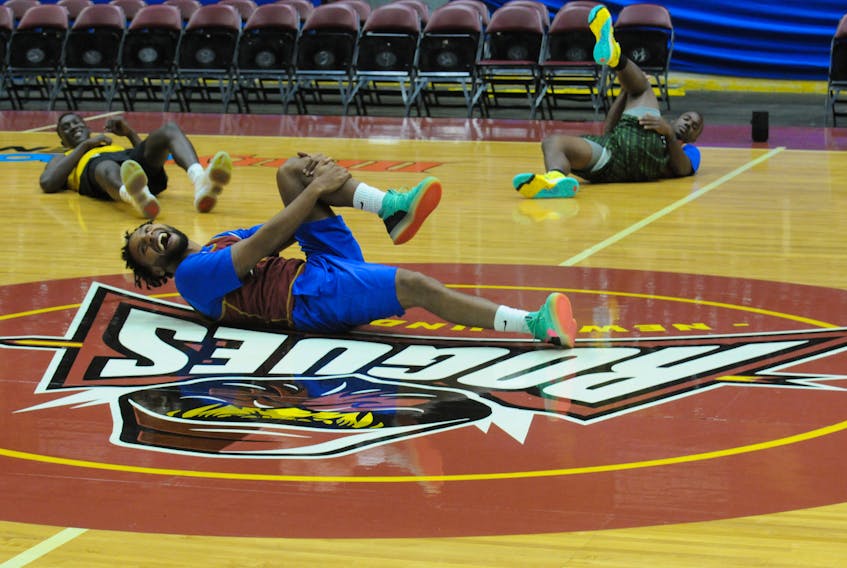 The Newfoundland Rogues, the newest entry into the American Basketball Association, took to their new home court at Mary Brown’s Centre in St. John’s Friday, Nov. 26, for a team practice. The team’s home opener is Saturday night. Here, player Kenny Holmes leads the team through their warm-up stretches before practice.  -Joe Gibbons/The Telegram