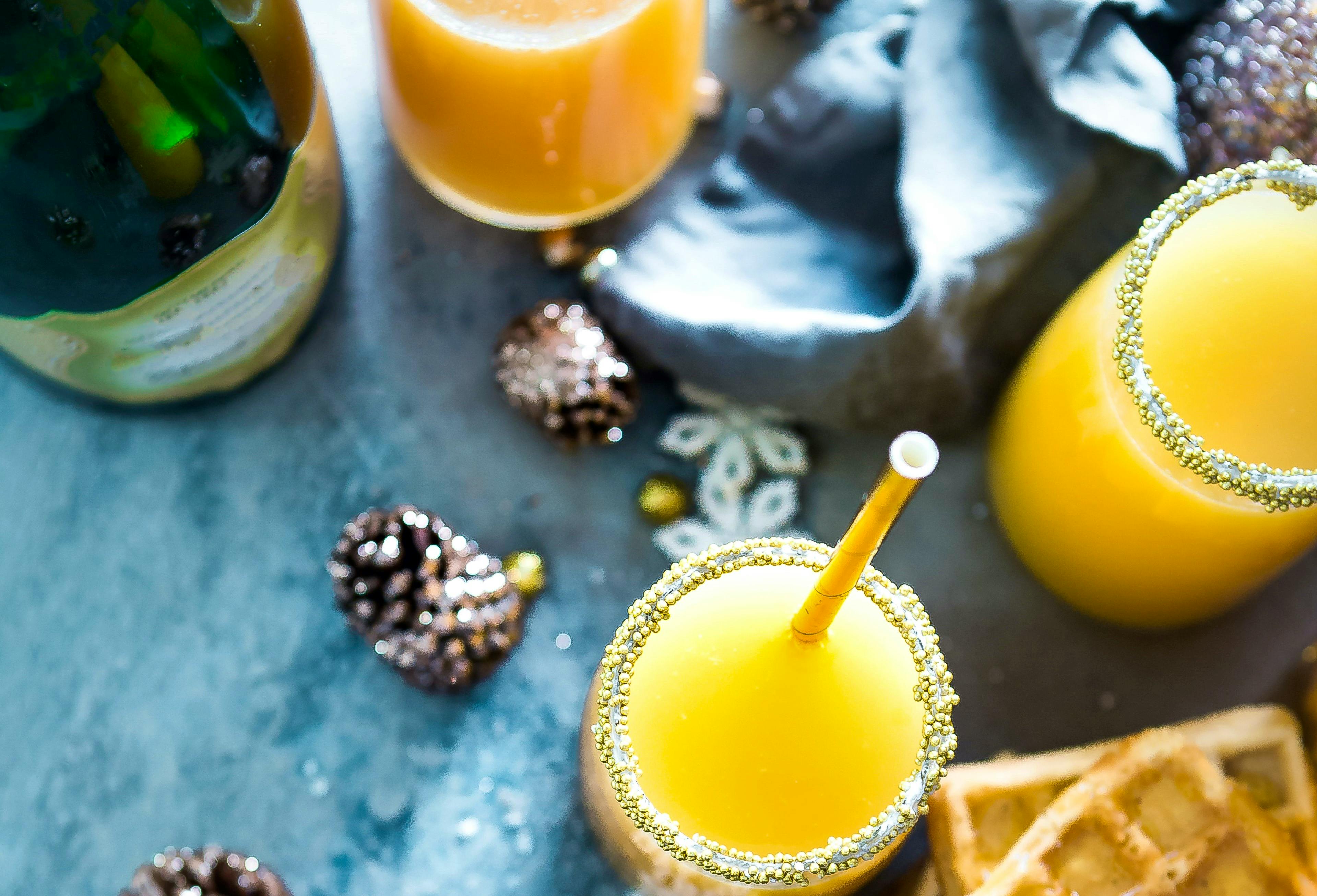 Mimosas are a classic holiday cocktail featuring orange juice and sparkling wine.