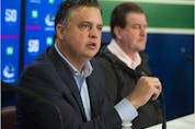 The jobs of Vancouver Canucks head coach Travis Green (left) and GM Jim Benning could be on the line if the Canucks can't find a way out of their current funk.