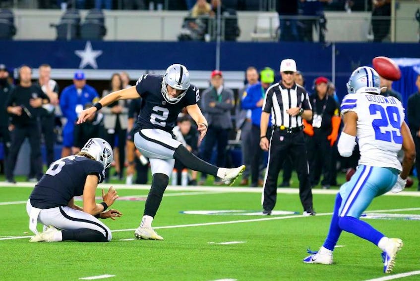 Raiders kicker Daniel Carlson kicks the winning field goal in overtime against the Dallas Cowboys in Arlington yesterday. Getty Images