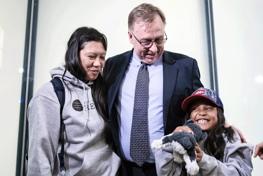 Vanessa Rodel, who helped shelter former CIA whistleblower Edward Snowden when he fled to Hong Kong, and daughter Keana hug lawyer Robert Tibbo in Toronto in this 2019 image. Now, Tibbo is being denied his lawyer of choice in a Hong Kong court.Vanessa Rodel, who helped shelter former CIA whistleblower Edward Snowden when he fled to Hong Kong, and daughter Keana hug lawyer Robert Tibbo in Toronto in this 2019 image. Now, Tibbo is being denied his lawyer of choice in a Hong Kong court.