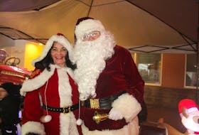 At the end of the Summerside parade, Santa Claus and Mrs. Claus were waiting, ready to great onlookers driving by in their cars.