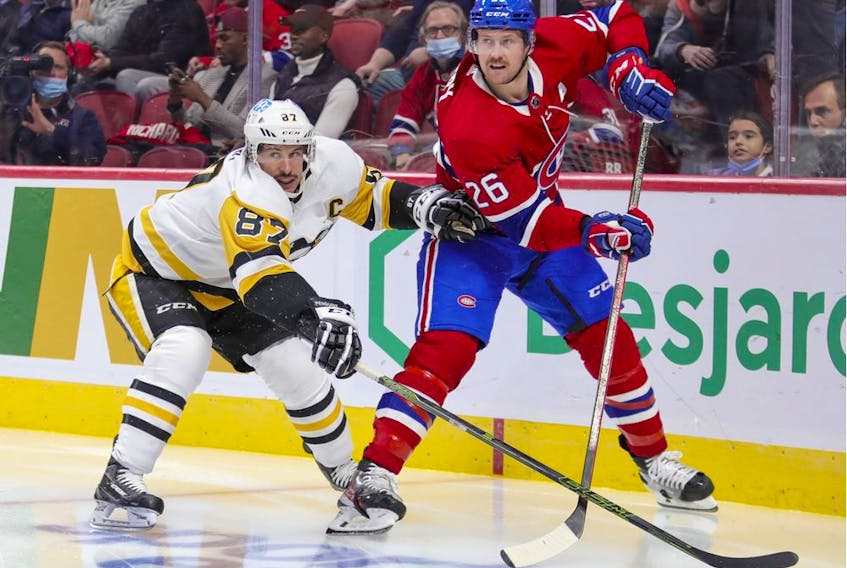 Canadiens' Jeff Petry is pressured by Pittsburgh Penguins' Sidney Crosby in Montreal on Nov. 18, 2021. 