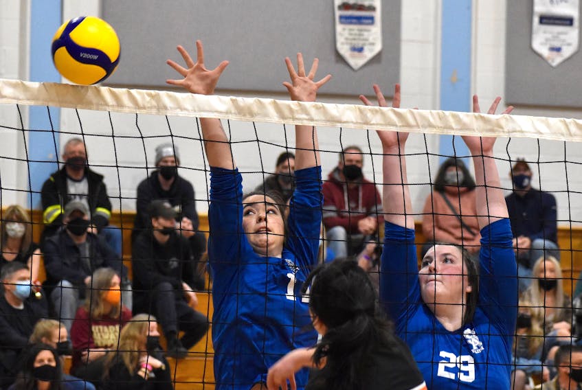 Desiree MacDonald, left, and Liz MacKenzie of the Sydney Academy Wildcats watches the ball go over the net during School Sport Nova Scotia junior varsity girls’ provincial championship action at the Centre Scolaire Étoile de L'Acadie gym in Sydney on Friday. JEREMY FRASER/CAPE BRETON POST.